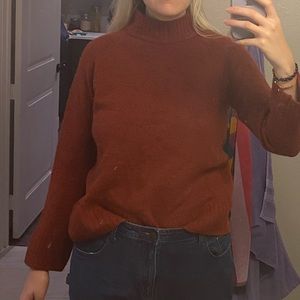 orange turtleneck